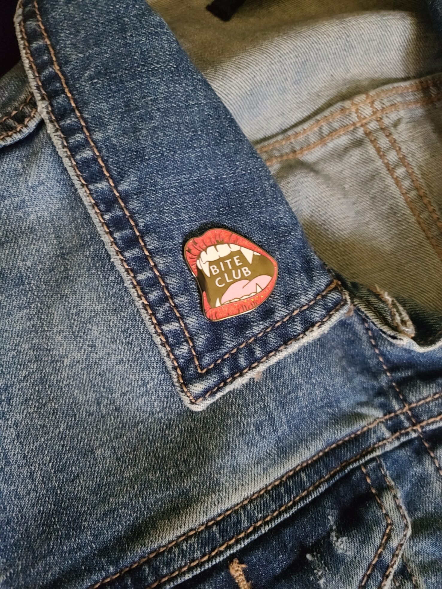 Bite Club pin on jean jacket