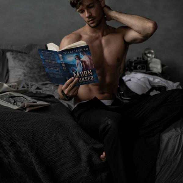 Male model reading Moon Cursed