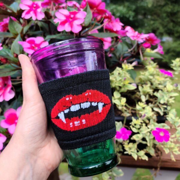 Vampire lips knit koozie on glass